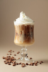 Cream and coffee cocktail on beige background.