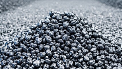 A close up view of a large pile of dark fragmented coal pieces