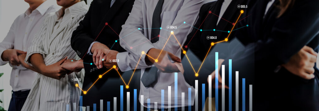 A modern office scene depicting business professionals collaborating with financial data visualizations, showcasing teamwork, analytics, and strategic insights. Scalp - Powered by Adobe