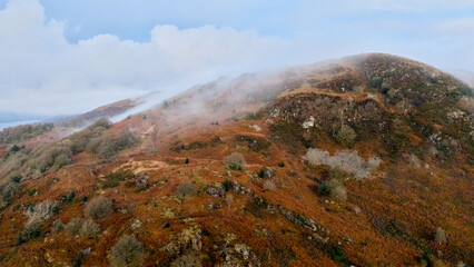 Autumn hillside with bracken and light mist drifting across the slopes. © PJSCreativeWorks