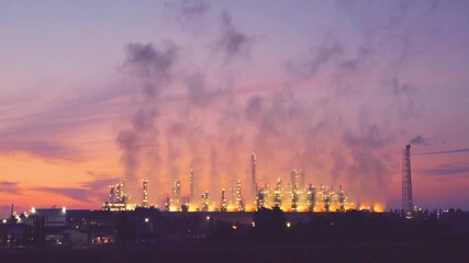 Industrial factory emitting smoke, illustrating air pollution and environmental issues, highlighting social impact and ecological concerns caused by manufacturing industries.