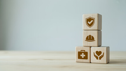 Wooden Blocks with Safety and Health Icons Representing Industrial Insurance and Workplace Protection Concept.png