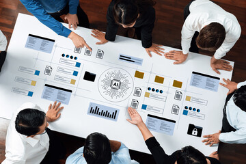 A diverse team collaborates on developing an AI strategy, using digital tools and visual data to drive insights and foster innovative ideas in a modern work environment. Gantry