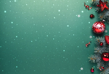 Christmas fir branches with red glitter decorations on green background with glitter, bokeh. Merry Christmas and Happy New Year greeting card. Xmas and winter holidays, top view