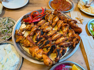 Turkish-style grilled chicken, cooked chicken wings. Ramadan meals.