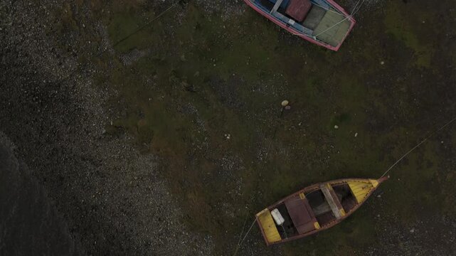 Aerial Overhead View of Colorful Fishing Boats Beached on Bay Shore