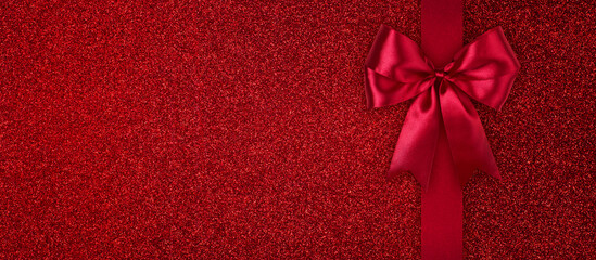 Red Glistering Gift Card with Ribbon Bow Top View with Copy Space