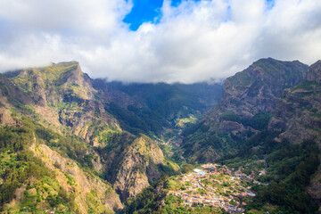 Naklejka premium Panoramic view of Curral das Freiras (Nuns Valley) from the Eira do Serrado viewpoint, Madeira, Portugal
