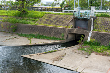 Nishitakase River canal next to Toba Water Environment Conservation Center, a facility for water management and sewage treatment. Kyoto, Japan.