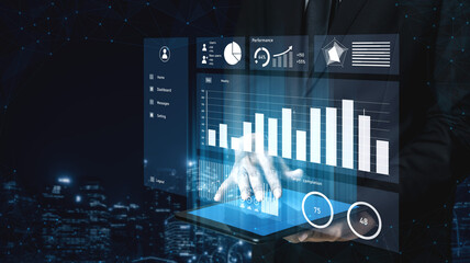 A professional businessman engages with a digital tablet showcasing vibrant graphs and charts, symbolizing data analysis and performance evaluation in a modern city setting. Impute