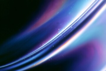 Fototapeta premium An abstract depiction of swirling colors blending in shades of blue and purple across a dark background.