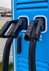 Close-up of connectors from an electric vehicle charging station