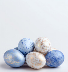 Pastel blue and gold Easter eggs arranged with copy space. Minimal spring holiday background for greeting cards, banners, promotions, social media posts, and seasonal branding.