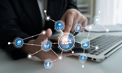 A professional workspace showcasing hands interacting with a smartphone, surrounded by network connection symbols, illustrating business technology and digital innovation. Crux