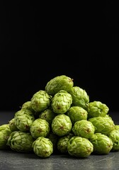 Fototapeta premium Fresh, aromatic green hop cones piled high, essential ingredients utilized in the brewing process for achieving bitter flavor, IBU, brewing process, brewing