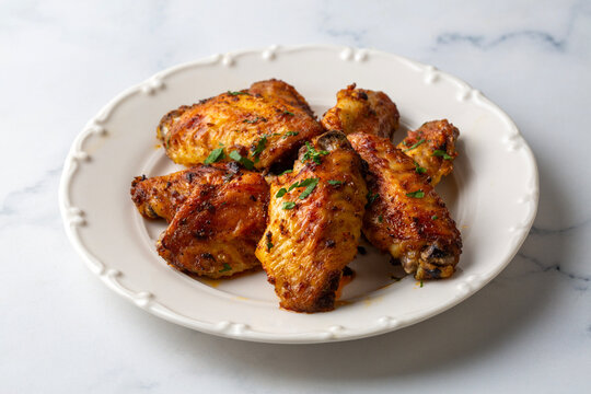 Oven-grilled chicken wings. Turkish name: Tavuk kanat