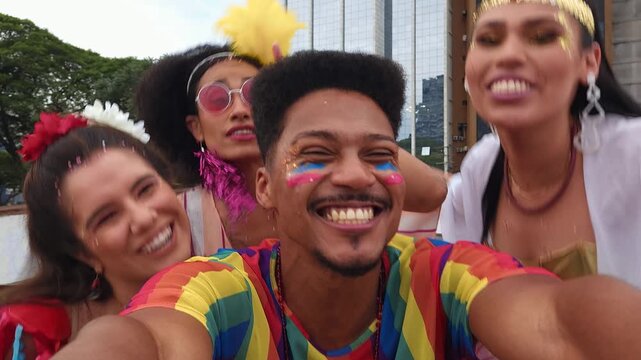 Group of friends joyfully capturing a selfie at Brazilian Carnival street festivities. Smiling faces in colorful costumes celebrating together in vibrant festival energy