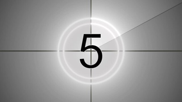 Vintage, old, projected film head leader with realtime countdown clock. Worn and damaged in style including marks, scratches and film grain to add a vintage look to your video. 4k video.