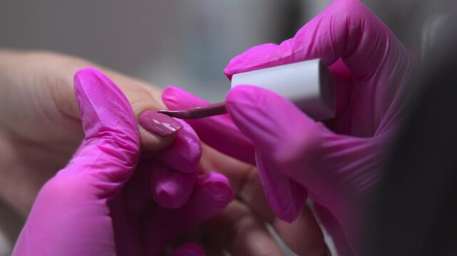 Gentle Brushwork With Pink Gloves, Precise Brush Strokes Create Textured Effects With Pink Hand Support. Media