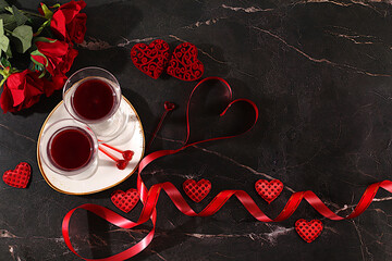 Valentine's Day or International Women's Day greeting card, banner, hearts, roses, and wine on the festive table. Birthday and wedding greetings, cafe advertising, bar menus