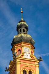 Fototapeta premium A clock tower of Saint Lawrence and Stephen in Innsbruck, Austria