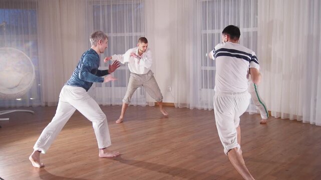 Martial arts. Four acrobatic man doing a turnover in a circle