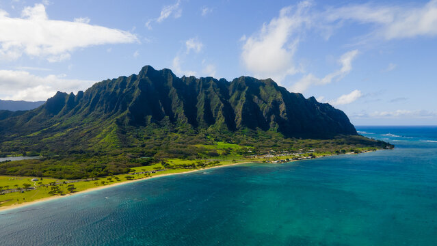 Aerial view of tropical mountain coastline with turquoise ocean - Powered by Adobe