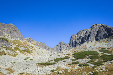 Rocky mountain pass and scree slopes in Valley of Five Polish Ponds, Tatra Mountains