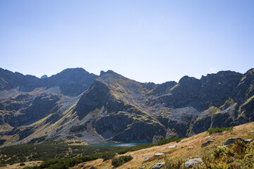 Mountain lake and rocky ridges below Kozi Wierch in  Valley of Five Polish Ponds, Tatra Mountains