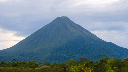 Fototapeta premium Clear View of a Majestic Arenal Volcano Seen from Monteverde in the Tropical Highlands of Costa Rica