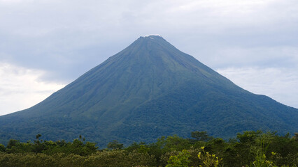 Fototapeta premium Clear View of a Majestic Arenal Volcano Seen from Monteverde in the Tropical Highlands of Costa Rica