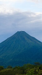 Fototapeta premium Clear View of a Majestic Arenal Volcano Seen from Monteverde in the Tropical Highlands of Costa Rica