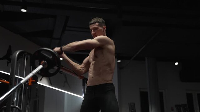 Sport sportsman with barbell landmine in gym. Bodybuilder in sport gym do landmine exercise. Sport bodybuilder with barbell landmine. Barbell landmine. Fitness and bodybuilding