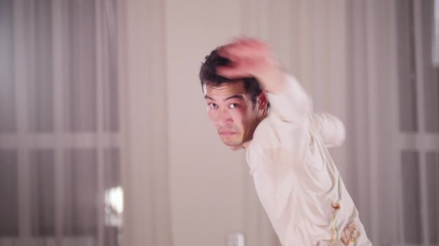Martial arts. A man performing an acrobatic capoeira kicking and jumping elements