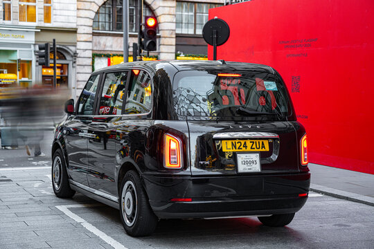 Black Cab Taxi, LEVC TX Logo (London Electric Vehicle Company) Hackney Carriage Minicab, Old Bond Street, Piccadilly, UK - December 30, 2025