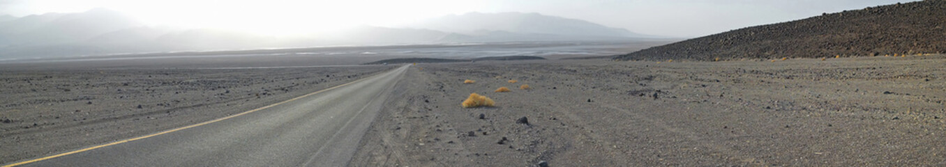 Panorama of road leading into Badwater Basin area in Death Valley National Park - Famous for being...