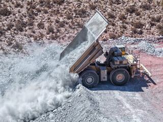 Process of dumping earth and waste with a huge mining dump truck at the landfill © WILL PHOTOGRAPHY