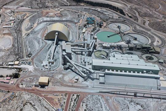 Mineral processing plant next to dome and flotation ponds