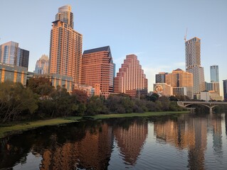 Fototapeta premium Austin landscape with bridge on river, autumn foliage