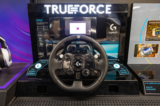 New-York, USA - 22.12.2025: Logitech G TrueForce racing wheel demo station displayed in electronics retail store, showcasing Logitech G923 steering wheel compatible with gaming systems