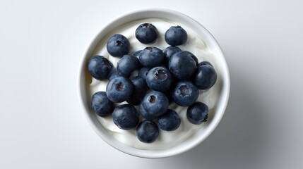 Top view bowl of fresh blueberries on white background