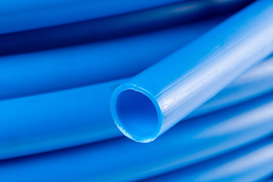 Close-up of a coiled blue plastic pipe