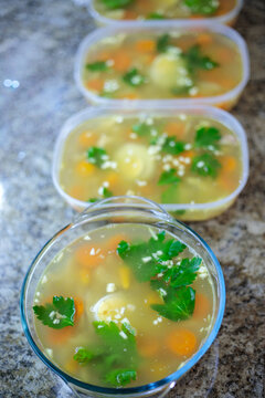 Traditional russian homemade meat jelly or holodets with carrots and parsley in containers delicious aspic with garlic and greens prepared for a feast