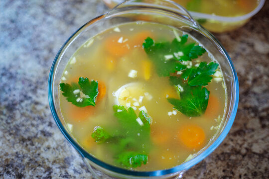 Traditional russian homemade meat jelly or holodets with carrots and parsley in containers delicious aspic with garlic and greens prepared for a feast