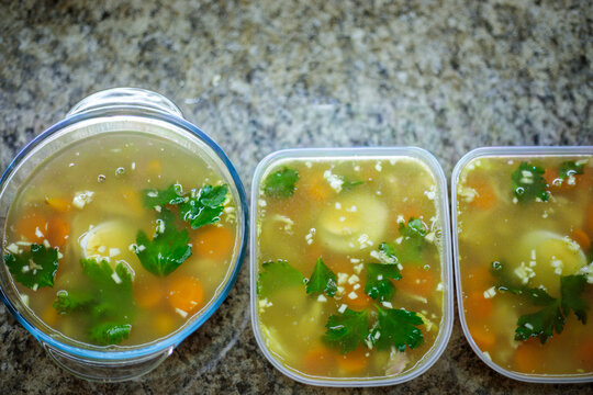 Traditional russian homemade meat jelly or holodets with carrots and parsley in containers delicious aspic with garlic and greens prepared for a feast