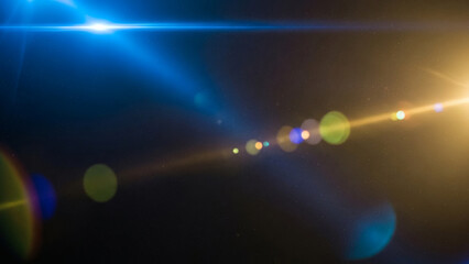 Blue light leaks and gradient over an abstract grainy background. Grainy colorful warm blue light leaks on a black background with a dust texture. Blue wavy abstract background for presentation