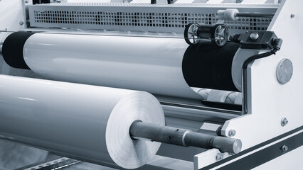 Large industrial automatic machine for cutting and gluing PVC film on wood chipboard and MDF boards...