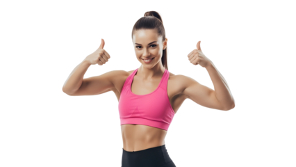A fit woman in sports bra shows thumbs up, perfect body gesture