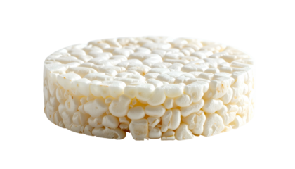 A close-up studio shot of a puffed rice cake, cylindrical, airy texture