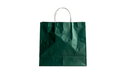 A green paper gift bag with white handles against a solid black background
